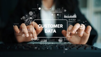 Business Professional Analyzing Customer Data with Digital Graphics and Charts in Modern Office...