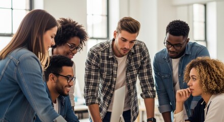 A diverse group of young creative professionals brainstorming together in a modern office. A multicultural team collaborating on a startup project.