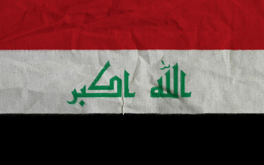 Close-Up of Iraqi Flag with Arabic Text in Vibrant Colors