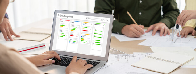 Project planning software for brisk business project management on the computer screen showing...
