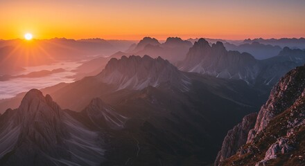Naklejka premium Majestic Mountain Range Sunrise with Golden Hues