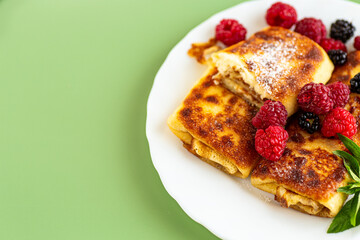 sweet homemade pancakes with cottage cheese and summer berries