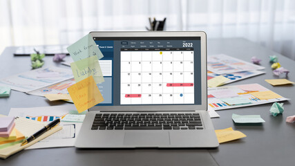 Sticky note for creative and analytic brainstorm for business idea with BI data dashboard on laptop...
