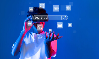 A young person engages with a virtual reality headset, exploring online search and digital...