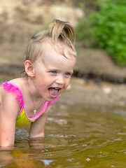little girl playing in the water