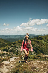 young woman hiking in mountains