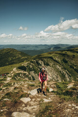 young woman hiking in mountains