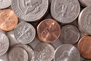 A stack of dollar coins stacked on each other in different positions. Money