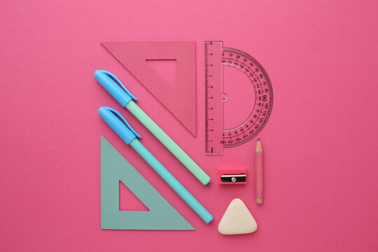 Stationery calculator ruler calculator and school stuff on coloured background. Concept of school and college learning