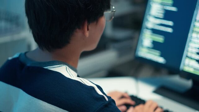 Programmer typing code software developer focused on technology systems data cloud interface digital workspace solution