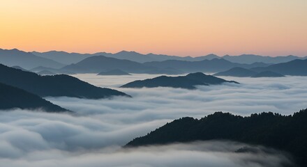 Obraz premium Serene Mountain Peaks Above Sea of Clouds at Sunrise