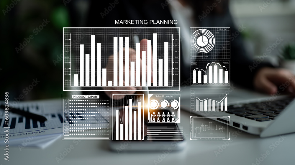 Poster a focused business professional engaged in marketing planning, analyzing data charts and graphs disp