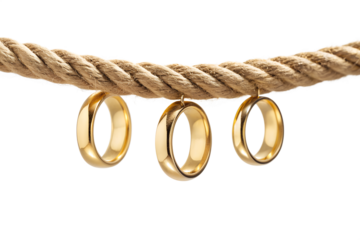 Three shiny golden wedding rings hanging from a thick, natural fiber rope, symbolizing commitment, unity, and the concept of tying the knot