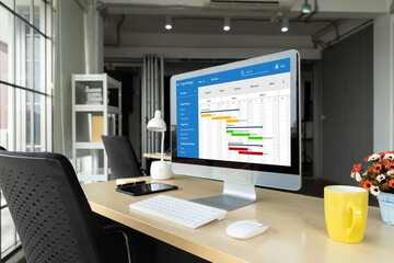 Project planning software for modish business project management on the computer screen showing timeline chart of the team project