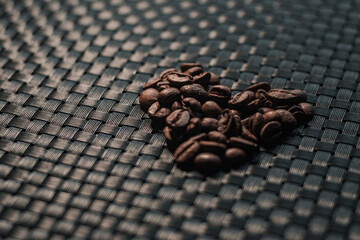 Premium coffee beans on a black background.