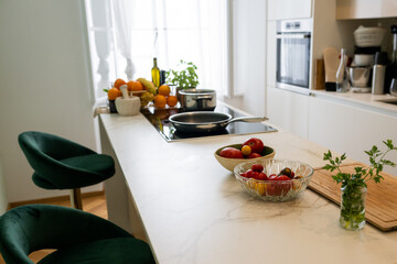 Bright Modern Kitchen Counter with Fresh Ingredients and Cooking Tools for Meal Preparation