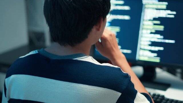 Young programmer typing code for software development technology systems interface data analysis cloud computing virtual solutions