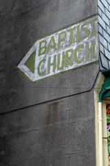 baptist church sign on a wall 