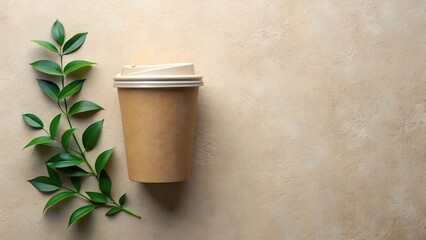 Eco friendly coffee cup with green branch on beige background