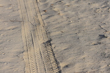 tire tracks in sand closeup