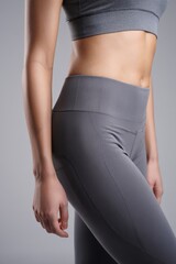 Female Athlete's Legs in Workout Leggings - Fitness and Health Concept