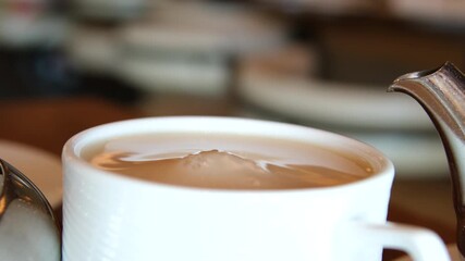 Slow Motion Hand Dropping Sugar Cube Into Black Coffee. Sugar Falling Down Into Coffee Cup. Coffee Caffeine Addiction Junk Food. Concept of Unhealthy Eating, Diabetes, Obesity, Heart Disease. - Powered by Adobe