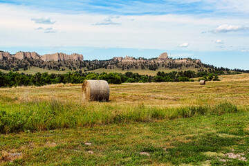 Freshly Cut Summer Hay Bales in the Field with the Pine Ridge Buttes on the Horizon, Fort Robinson...