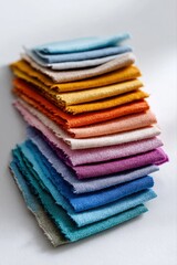 Stack of colorful fabric samples in vibrant textile display