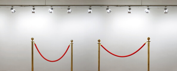 Golden barrier with red rope seamless line on a art gallery wall background