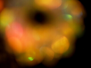 Colorful light leaks on black background for design and special effects. Retro film look. Abstract...