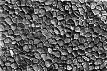 Gray Pebble Stone Wall Texture.A tightly packed gray pebble wall offering a coarse and uniform...