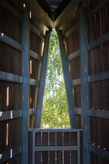 Light through the narrow window in a wooden building