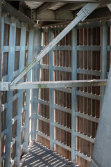 Sunlight through the Roof structure consisting of a metal frame and wooden beams