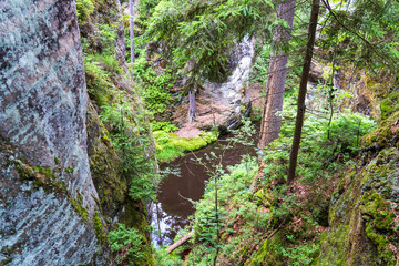 Adrspach, Czech Republic - 20.07.2025: View of the Adrspach-Teplice Rocks with Lake Piskovna. Forest and rocks.