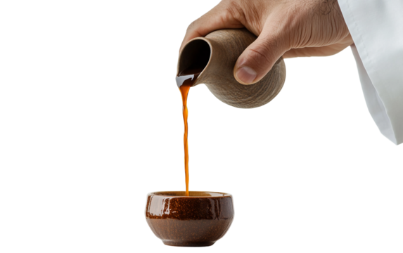Middle Eastern man preparing and pouring coffee during traditional ceremony isolated on transparent background PNG - Powered by Adobe