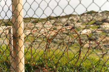barbed wire fence with landscape