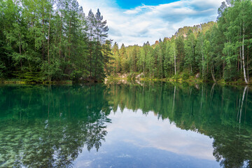 Adrspach, Czech Republic - 20.07.2025: View of the Adrspach-Teplice Rocks with Lake Piskovna. Forest and rocks.