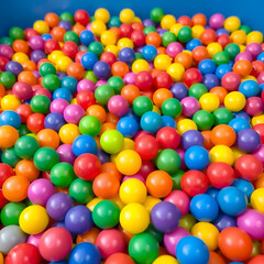 Colorful ball pit balls fill a play area, stimulating sensory exploration,  daycare,  education