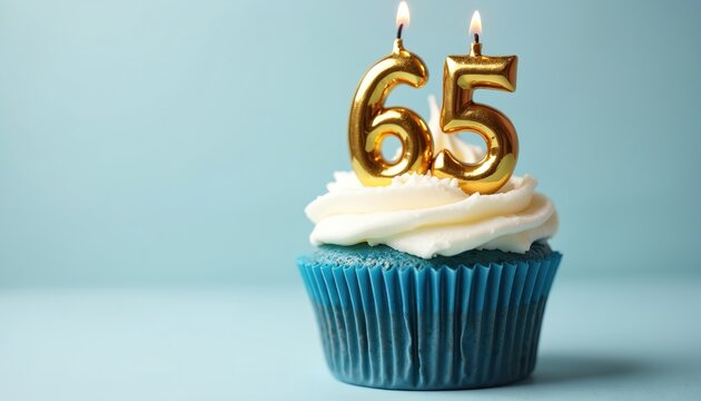 Golden number 65 candles adorn a blue cupcake topped with creamy white frosting. This festive dessert celebrates a milestone birthday or anniversary, perfect for any sweet celebration event.