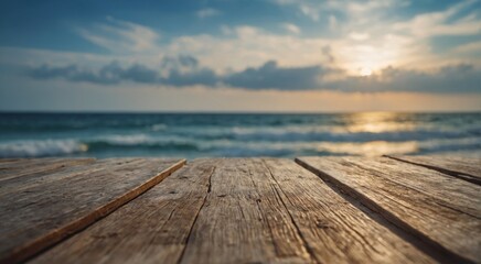 Fototapeta premium Beautiful sunset over the ocean, viewed from a weathered wooden surface.