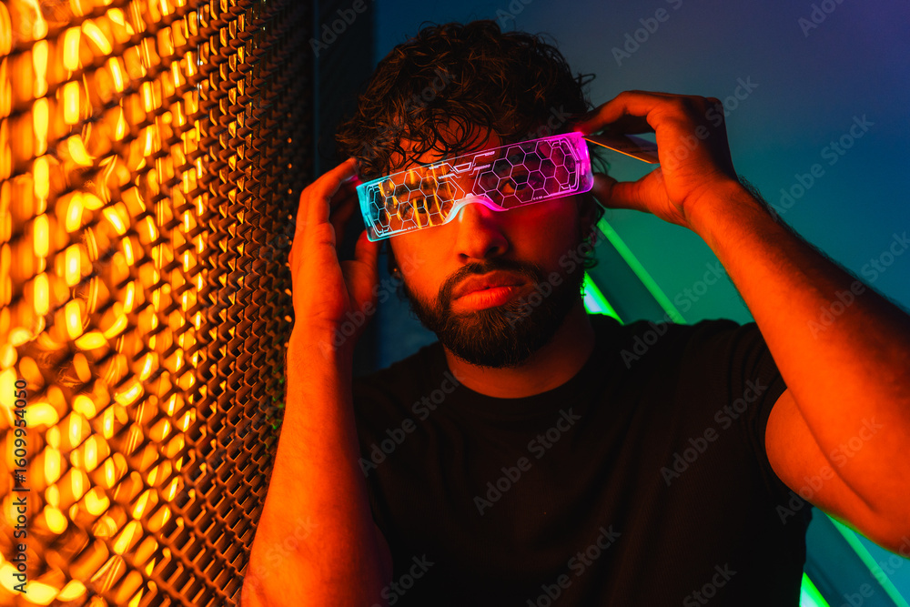 Poster young latin software developer adjusting smart glasses with augmented reality features in front of i