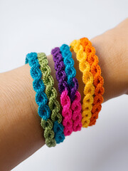 Close-up of a handcrafted rainbow-colored crocheted bracelet