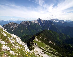 Alpine vista, rocky ridge, lush valleys