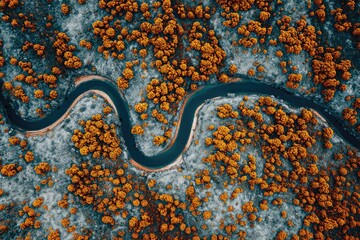 Aerial view of winding river through ochre landscape