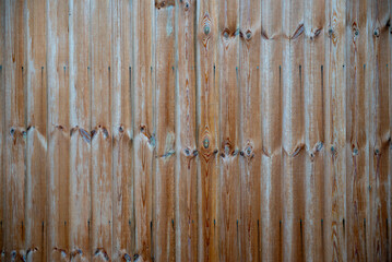 Vertical Natural Wood Panels with Rustic Texture and Knots