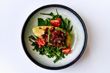 Deliciously Crafted Dish Featuring Avocado, Fresh Vegetables, and Flavorful Toppings on a Bed of Greens for a Healthy Meal Experience