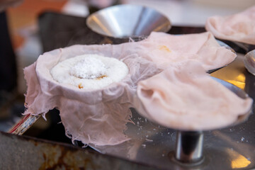 Steaming the Malaysian dessert Putu Piring