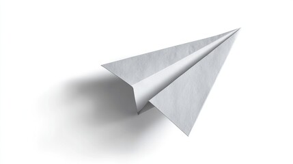 A single, white paper airplane casts a shadow on a white surface. The plane is sharply angled
