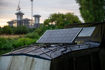 Solar Panel on Boat Roof in Nature with Industrial Background