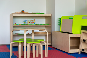 Modern Montessori Classroom Interior with Wooden Furniture and Educational Toys